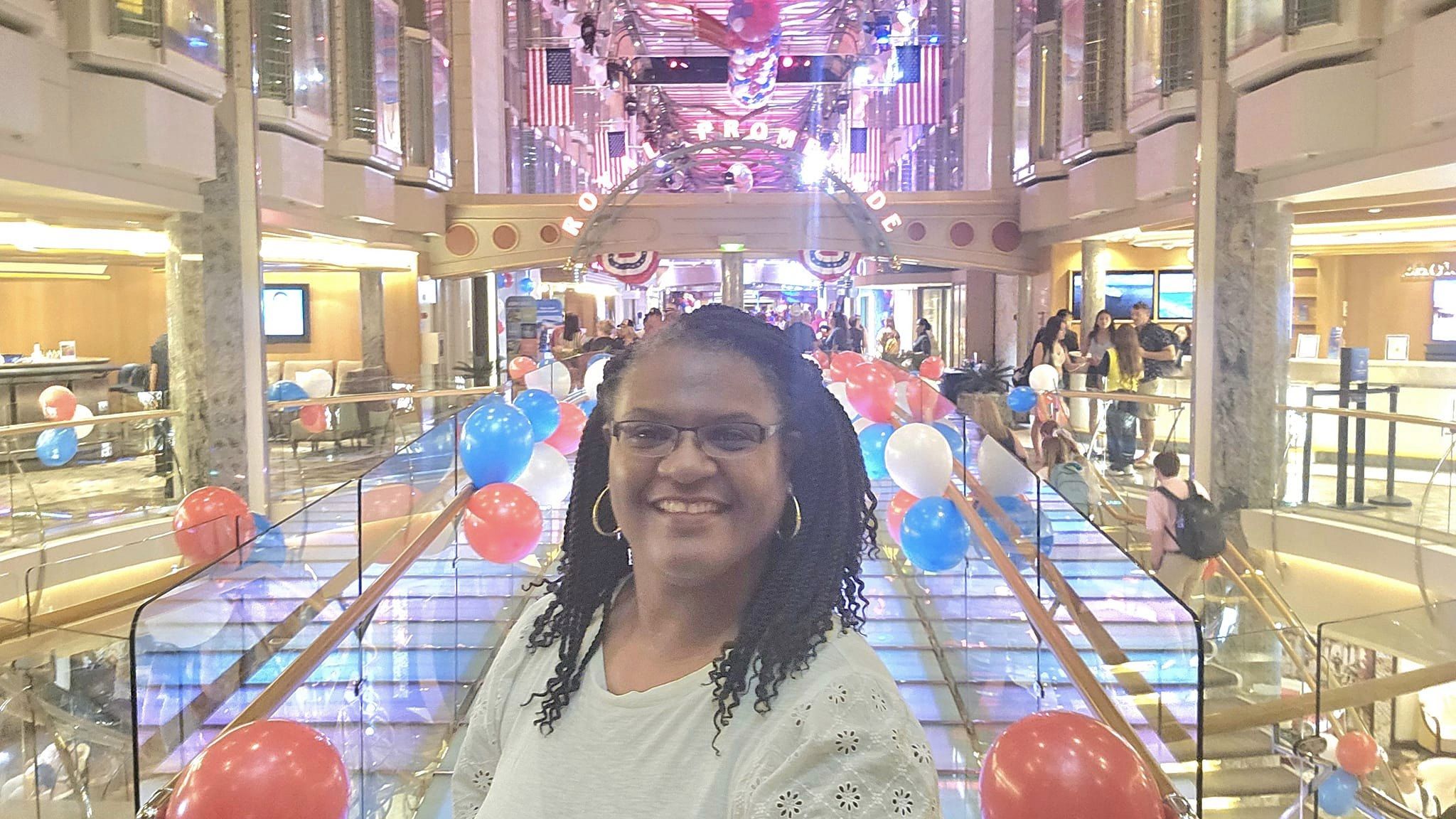 Lynnelle smiling aboard a cruise ship